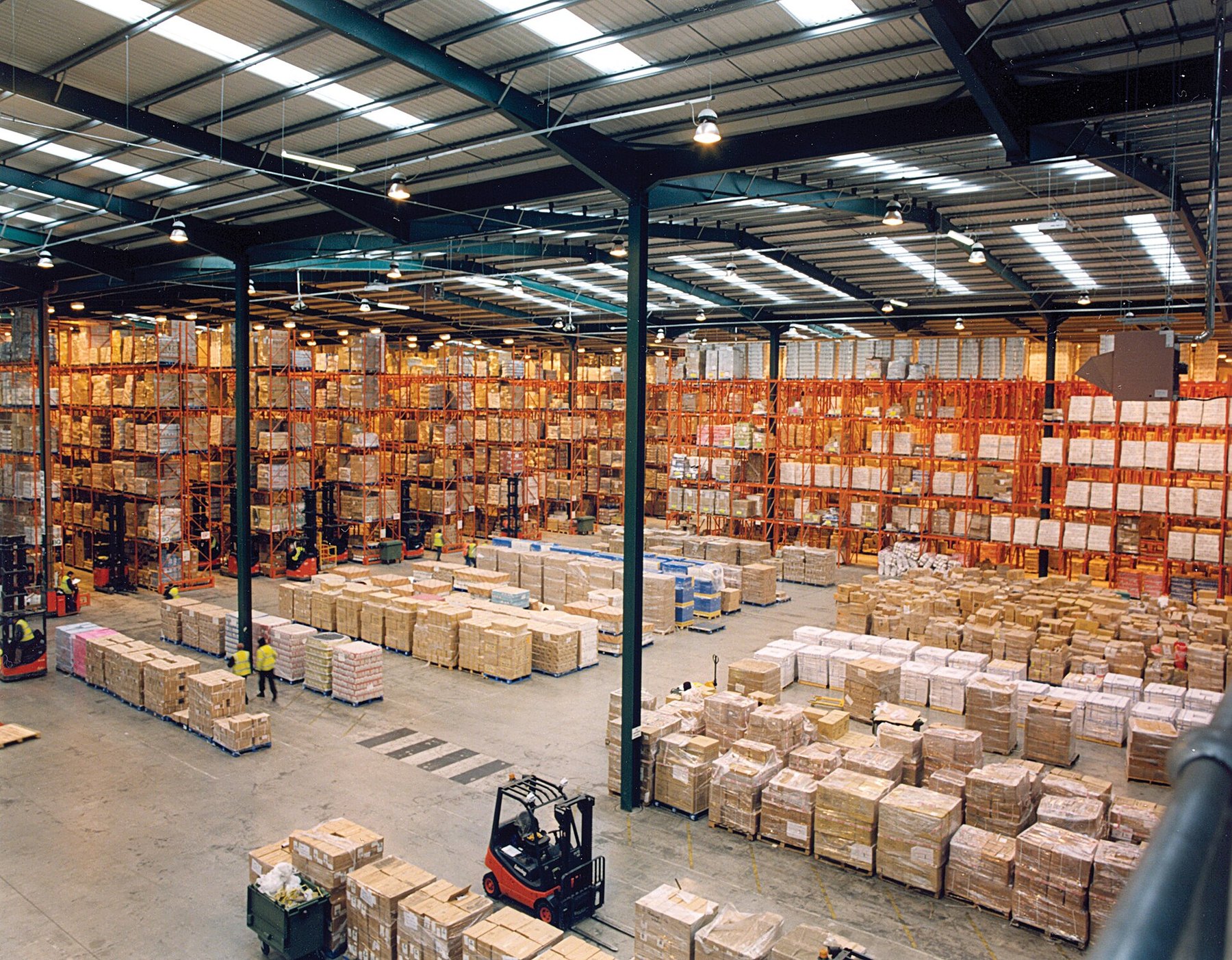 Rows of storage racks inside a modern warehouse